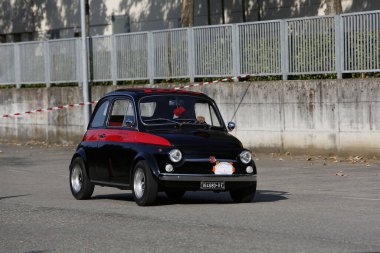 Bibbiano-Reggio Emilia Italy - 07 15 2015 : Free rally of vintage cars in the town square Fiat 500 black. High quality photo