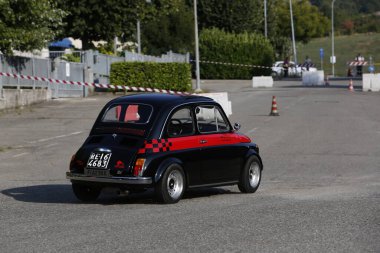 Bibbiano-Reggio Emilia Italy - 07 15 2015 : Free rally of vintage cars in the town square Fiat 500 black. High quality photo