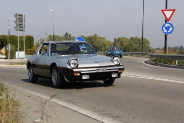 Bibbiano-Reggio Emilia Italy - 07 15 2015 : Free rally of vintage cars in the town square Fiat x 19 street. High quality photo