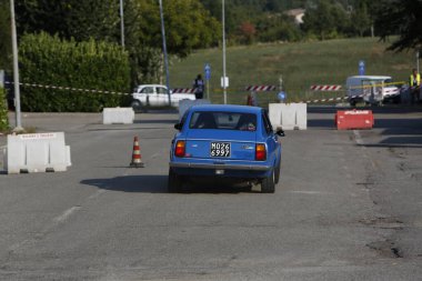 Bibbiano-Reggio Emilia Italy - 07 15 2015 : Free rally of vintage cars in the town square Fiat 124 Rally Blue. High quality photo