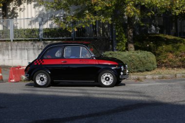 Bibbiano-Reggio Emilia Italy - 07 15 2015 : Free rally of vintage cars in the town square Fiat 500 black. High quality photo