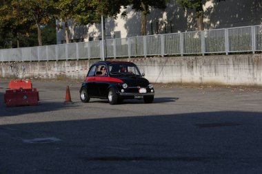 Bibbiano-Reggio Emilia Italy - 07 15 2015 : Free rally of vintage cars in the town square Fiat 500 black. High quality photo