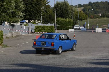Bibbiano-Reggio Emilia Italy - 07 15 2015 : Free rally of vintage cars in the town square Fiat 124 Rally Blue. High quality photo