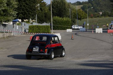 Bibbiano-Reggio Emilia Italy - 07 15 2015 : Free rally of vintage cars in the town square Fiat 500 black. High quality photo