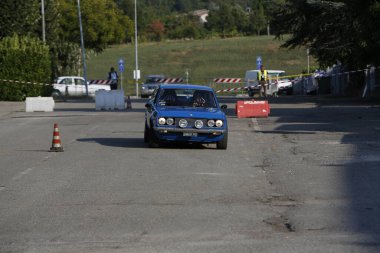 Bibbiano-Reggio Emilia Italy - 07 15 2015 : Free rally of vintage cars in the town square Fiat 124 Rally Blue. High quality photo