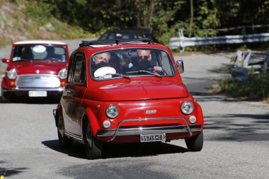 Bibbiano-Reggio Emilia Italy - 07 15 2015 : Free rally of vintage cars in the town square Fiat 500 red. High quality photo
