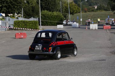 Bibbiano-Reggio Emilia Italy - 07 15 2015 : Free rally of vintage cars in the town square Fiat 500 black. High quality photo