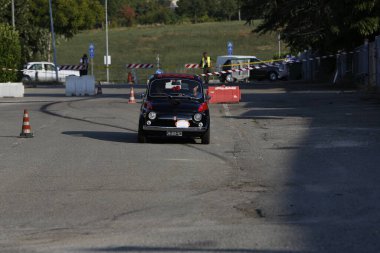 Bibbiano-Reggio Emilia Italy - 07 15 2015 : Free rally of vintage cars in the town square Fiat 500 black. High quality photo