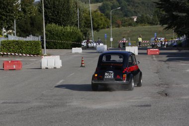 Bibbiano-Reggio Emilia Italy - 07 15 2015 : Free rally of vintage cars in the town square Fiat 500 black. High quality photo