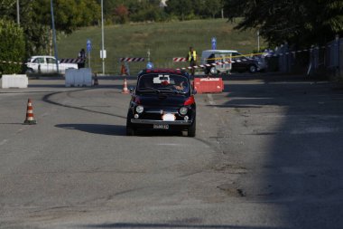 Bibbiano-Reggio Emilia Italy - 07 15 2015 : Free rally of vintage cars in the town square Fiat 500 black. High quality photo