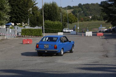 Bibbiano-Reggio Emilia Italy - 07 15 2015 : Free rally of vintage cars in the town square Fiat 124 Rally Blue. High quality photo