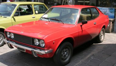 Bibbiano-Reggio Emilia Italy - 07 15 2015 : Free rally of vintage cars in the town square Fiat 124 rally. High quality photo