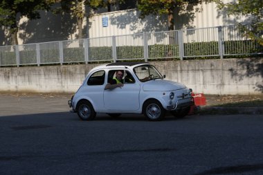 Bibbiano-Reggio Emilia Italy - 07 15 2015 : Free rally of vintage cars in the town square white Fiat 500. High quality photo
