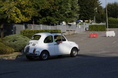 Bibbiano-Reggio Emilia Italy - 07 15 2015 : Free rally of vintage cars in the town square white Fiat 500. High quality photo