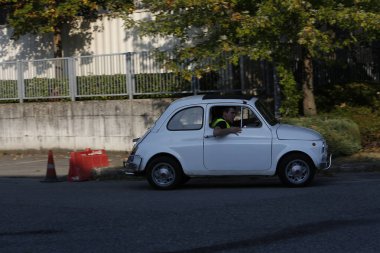 Bibbiano-Reggio Emilia Italy - 07 15 2015 : Free rally of vintage cars in the town square white Fiat 500. High quality photo