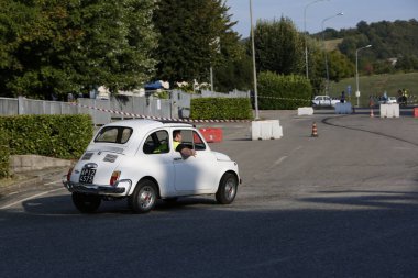 Bibbiano-Reggio Emilia Italy - 07 15 2015 : Free rally of vintage cars in the town square white Fiat 500. High quality photo