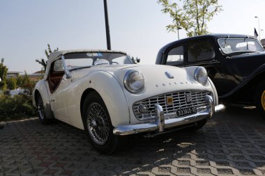 Bibbiano-Reggio Emilia Italy - 07 15 2015 : Free rally of vintage cars in the town square Triumph TR2 Cars. High quality photo