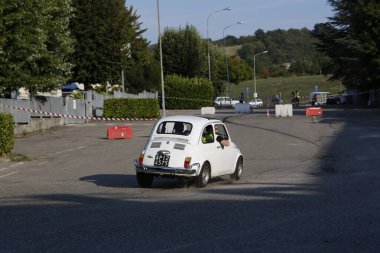 Bibbiano-Reggio Emilia Italy - 07 15 2015 : Free rally of vintage cars in the town square white Fiat 500. High quality photo