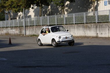 Bibbiano-Reggio Emilia Italy - 07 15 2015 : Free rally of vintage cars in the town square white Fiat 500. High quality photo