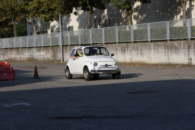 Bibbiano-Reggio Emilia Italy - 07 15 2015 : Free rally of vintage cars in the town square white Fiat 500. High quality photo
