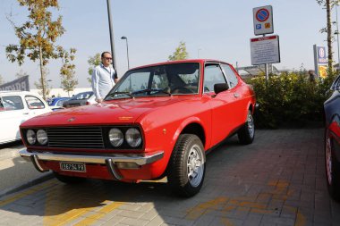 Bibbiano-Reggio Emilia Italy - 07 15 2015 : Free rally of vintage cars in the town square Fiat 124 Rally. High quality photo