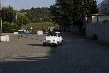 Bibbiano-Reggio Emilia Italy - 07 15 2015 : Free rally of vintage cars in the town square white Fiat 500. High quality photo