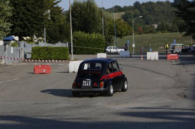 Bibbiano-Reggio Emilia Italy - 07 15 2015 : Free rally of vintage cars in the town square Fiat 500 black. High quality photo
