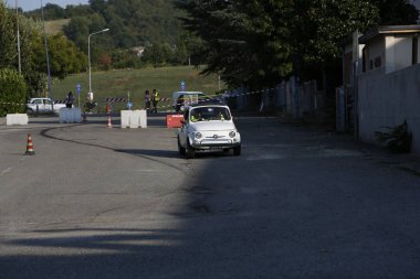 Bibbiano-Reggio Emilia Italy - 07 15 2015 : Free rally of vintage cars in the town square white Fiat 500. High quality photo