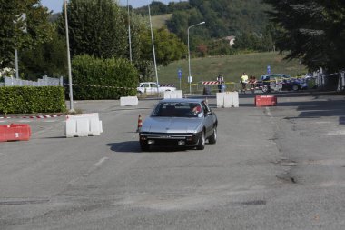 Bibbiano-Reggio Emilia Italy - 07 15 2015 : Free rally of vintage cars in the town square Fiat x 19 street. High quality photo