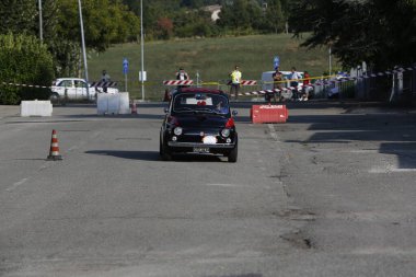 Bibbiano-Reggio Emilia Italy - 07 15 2015 : Free rally of vintage cars in the town square Fiat 500 black. High quality photo