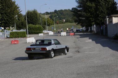 Bibbiano-Reggio Emilia Italy - 07 15 2015 : Free rally of vintage cars in the town square Fiat x 19 street. High quality photo