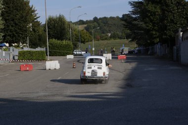 Bibbiano-Reggio Emilia Italy - 07 15 2015 : Free rally of vintage cars in the town square white Fiat 500. High quality photo