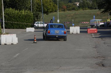 Bibbiano-Reggio Emilia Italy - 07 15 2015 : Free rally of vintage cars in the town square Fiat 124 Rally Blue. High quality photo