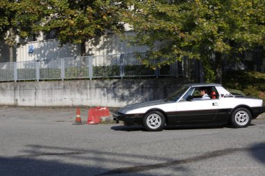 Bibbiano-Reggio Emilia Italy - 07 15 2015 : Free rally of vintage cars in the town square Fiat x 19 street. High quality photo