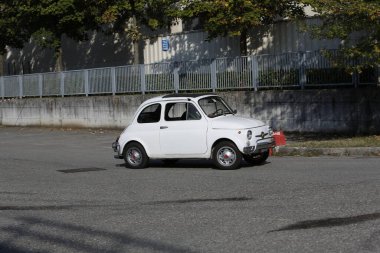 Bibbiano-Reggio Emilia Italy - 07 15 2015 : Free rally of vintage cars in the town square white Fiat 500. High quality photo