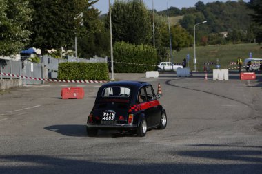 Bibbiano-Reggio Emilia Italy - 07 15 2015 : Free rally of vintage cars in the town square Fiat 500 black. High quality photo