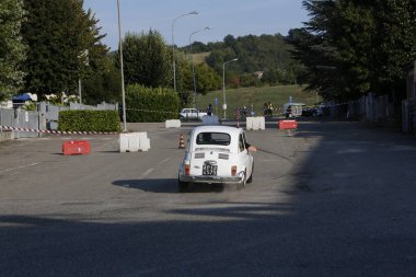 Bibbiano-Reggio Emilia Italy - 07 15 2015 : Free rally of vintage cars in the town square white Fiat 500. High quality photo