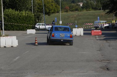 Bibbiano-Reggio Emilia Italy - 07 15 2015 : Free rally of vintage cars in the town square Fiat 124 Rally Blue. High quality photo