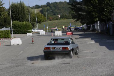 Bibbiano-Reggio Emilia Italy - 07 15 2015 : Free rally of vintage cars in the town square Fiat x 19 street. High quality photo