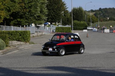 Bibbiano-Reggio Emilia Italy - 07 15 2015 : Free rally of vintage cars in the town square Fiat 500 black. High quality photo