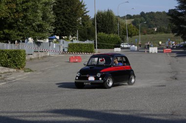 Bibbiano-Reggio Emilia Italy - 07 15 2015 : Free rally of vintage cars in the town square Fiat 500 black. High quality photo