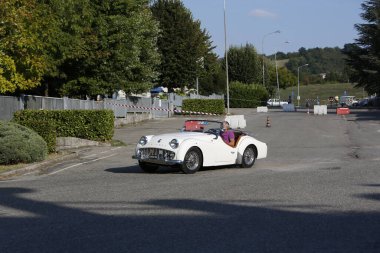 Bibbiano-Reggio Emilia Italy - 07 15 2015 : Free rally of vintage cars in the town square Triumph TR2 Cars. High quality photo