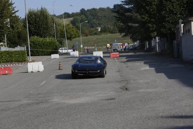 Bibbiano-Reggio Emilia Italy - 07 15 2015 : Free rally of vintage cars in the town square dark Blue Maserati Bora. High quality photo