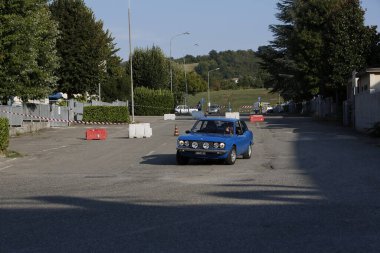 Bibbiano-Reggio Emilia Italy - 07 15 2015 : Free rally of vintage cars in the town square Fiat 124 Rally Blue. High quality photo