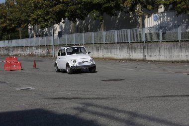 Bibbiano-Reggio Emilia Italy - 07 15 2015 : Free rally of vintage cars in the town square white Fiat 500. High quality photo