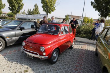 Bibbiano-Reggio Emilia Italy - 07 15 2015 : Free rally of vintage cars in the town square Fiat 500 red. High quality photo