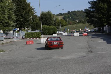 Bibbiano-Reggio Emilia Italy - 07 15 2015 : Free rally of vintage cars in the town square red Fiat X1 9 . High quality photo