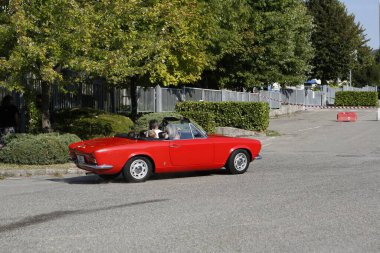 Bibbiano-Reggio Emilia Italy - 07 15 2015 : Free rally of vintage cars in the town square Fiat 124 Spider. High quality photo
