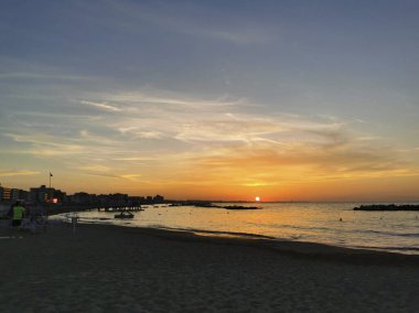 beach in Italy's Romagna Riviera at sunset. High quality photo
