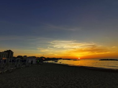 beach in Italy's Romagna Riviera at sunset. High quality photo